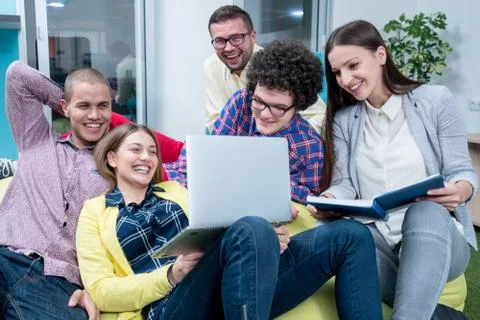 Young start up team disccusing projects Stock Photos