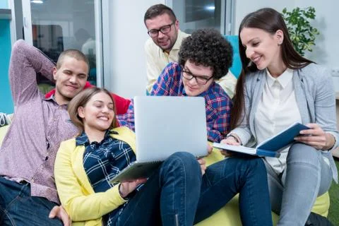 Young start up team disccusing projects Stock Photos