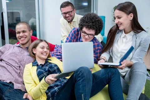 Young start up team disccusing projects Stock Photos