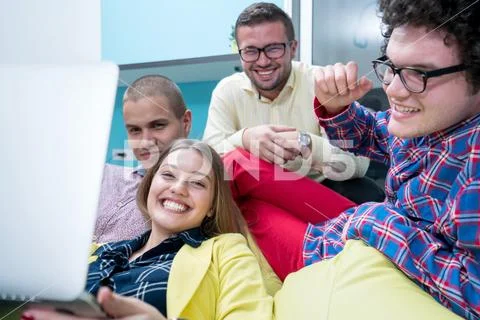 Young start up team disccusing projects Stock Photos