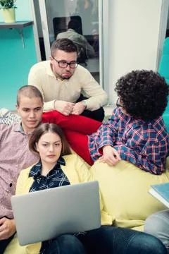 Young start up team disccusing projects Stock Photos