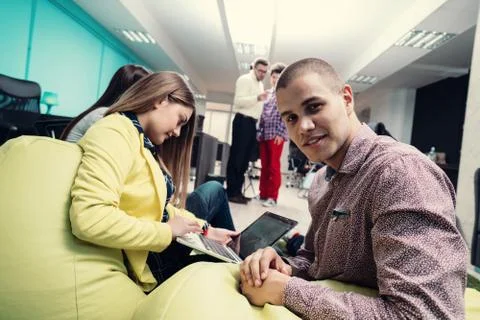 Young start up team disccusing projects Stock Photos