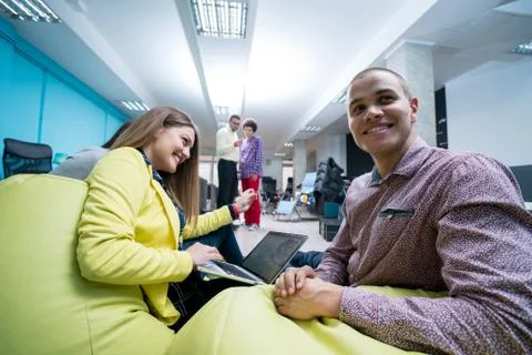 Young start up team disccusing projects Stock Photos