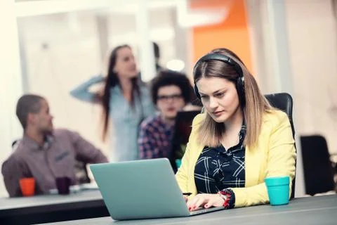 Young start up team disccusing projects Stock Photos