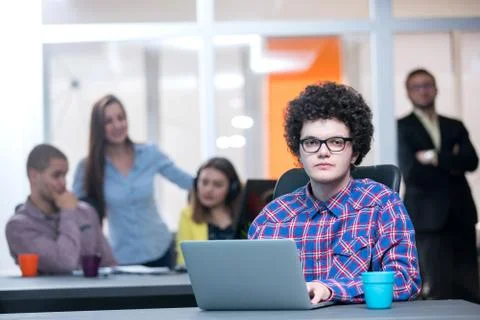 Young start up team disccusing projects Stock Photos