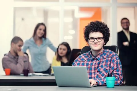 Young start up team disccusing projects Stock Photos