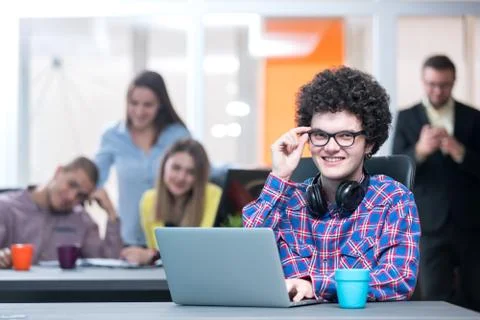 Young start up team disccusing projects Stock Photos