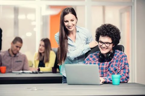 Young start up team disccusing projects Stock Photos