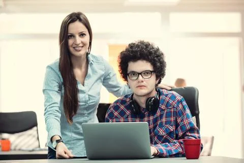 Young start up team disccusing projects Stock Photos