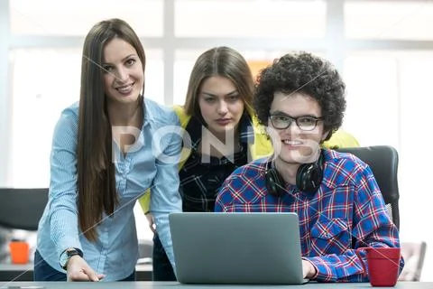 Young start up team disccusing projects Stock Photos