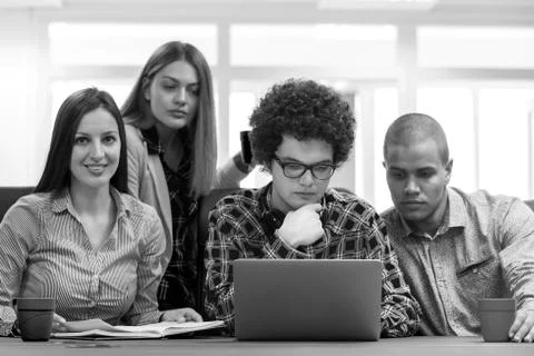 Young start up team disccusing projects Stock Photos