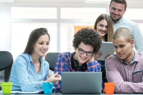 Young start up team disccusing projects Stock Photos