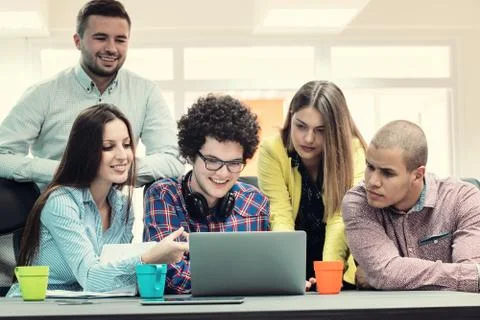 Young start up team disccusing projects Stock Photos