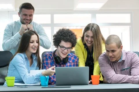 Young start up team disccusing projects Stock Photos