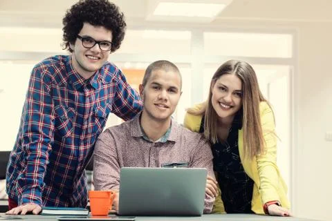 Young start up team disccusing projects Stock Photos
