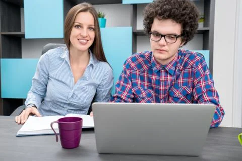Young start up team disccusing projects Stock Photos