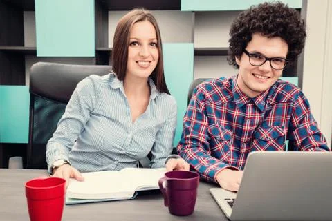 Young start up team disccusing projects Stock Photos