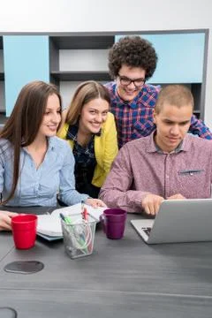 Young start up team disccusing projects Stock Photos
