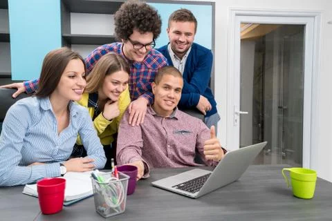 Young start up team disccusing projects Stock Photos
