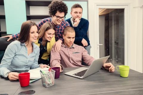 Young start up team disccusing projects Stock Photos