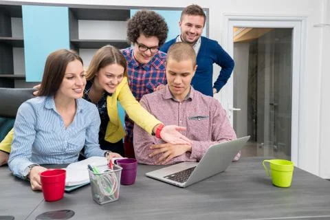 Young start up team disccusing projects Stock Photos