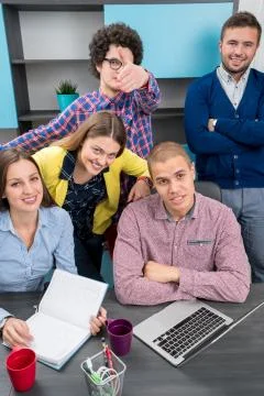 Young start up team disccusing projects Stock Photos