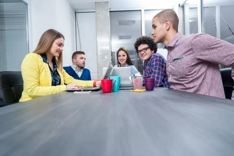 Young start up team disccusing projects Stock Photos