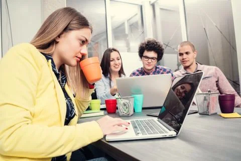 Young start up team disccusing projects Stock Photos