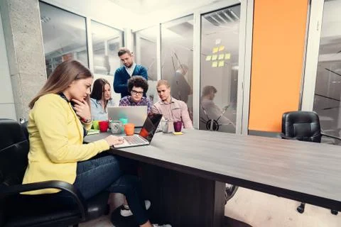 Young start up team disccusing projects Stock Photos