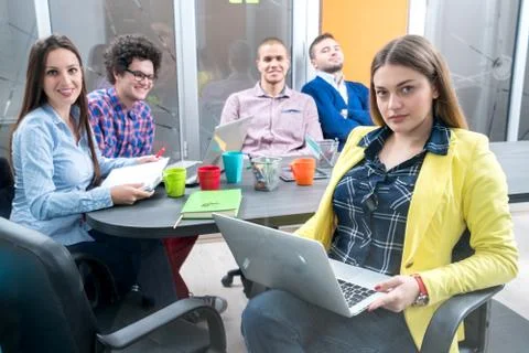 Young start up team disccusing projects Stock Photos