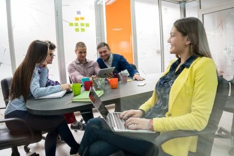 Young start up team disccusing projects Stock Photos