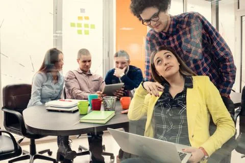 Young start up team disccusing projects Stock Photos