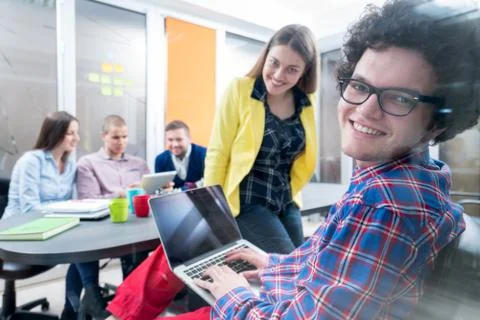 Young start up team disccusing projects Stock Photos