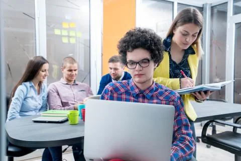 Young start up team disccusing projects Stock Photos