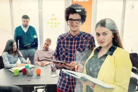 Young start up team disccusing projects Stock Photos