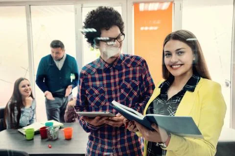 Young start up team disccusing projects Stock Photos