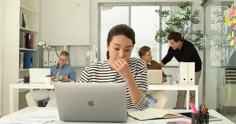 Young startup members working in the office Stock Footage 100958715