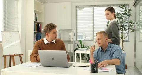Young startup members working in the office Stock Footage 100958877