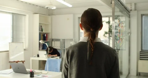 Young startup members working in the office Stock Footage 100958946