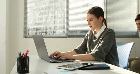 Young startup members working in the office Stock Footage 100959419