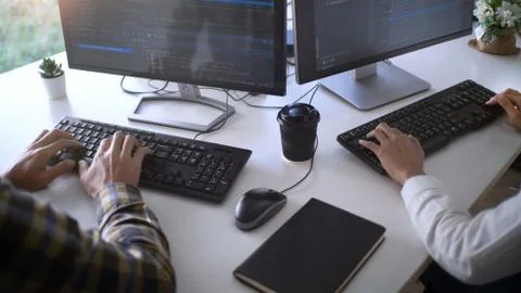 Young startup Programmers Sitting At Desks Working On Computers screen for De 스톡 사진
