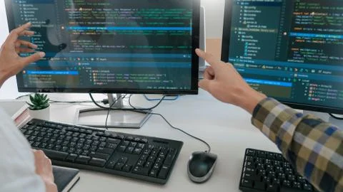 Young startup Programmers Sitting At Desks Working On Computers screen for De 스톡 사진