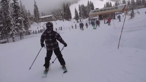 Young stoked skier throws hands in air Stock-Footage 120058995