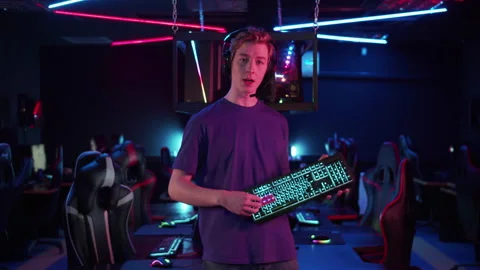 A young streamer talks about the advantages of the new gaming keyboard to his Stock Footage 152800807