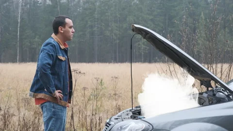 Young stressed man having trouble with his broken car Stock Footage 145122114