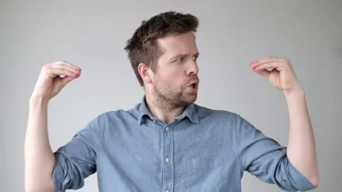 Young stressed man talking to his hands, suffering mental bipolar disorder. 스톡 동영상 120007012