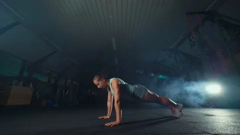 Young strong girl doing push ups Stock Footage 131029218