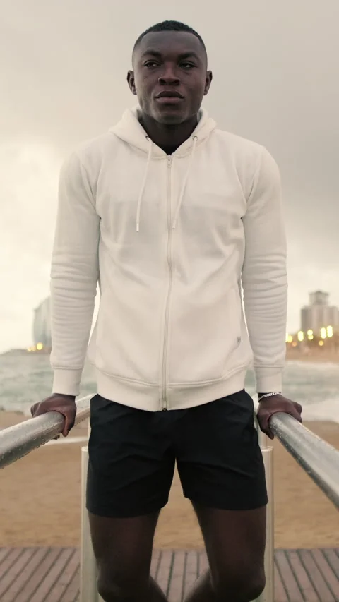 Young strong man doing dips on parallel bars Stock Footage 280347403