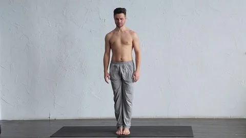 A young strong man doing yoga exercises. Stock Footage 71239455