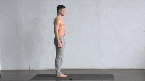 A young strong man doing yoga exercises.  Stock Footage 71239769